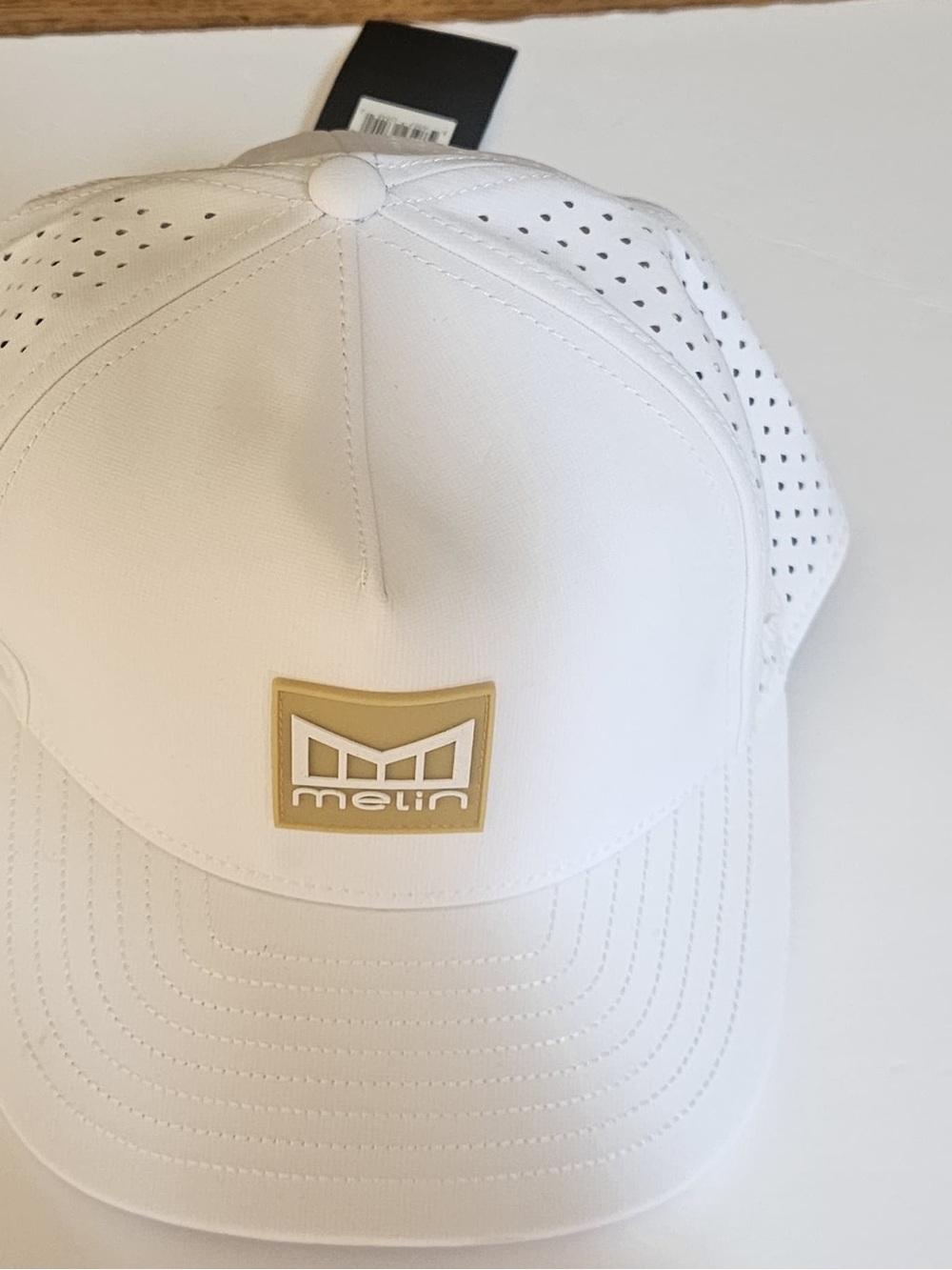 Melin Men's White Performance Cap with Gold Logo